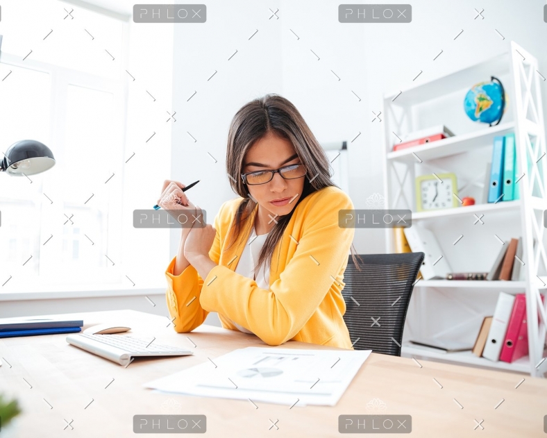 businesswoman-analysing-document-P8WSNMC